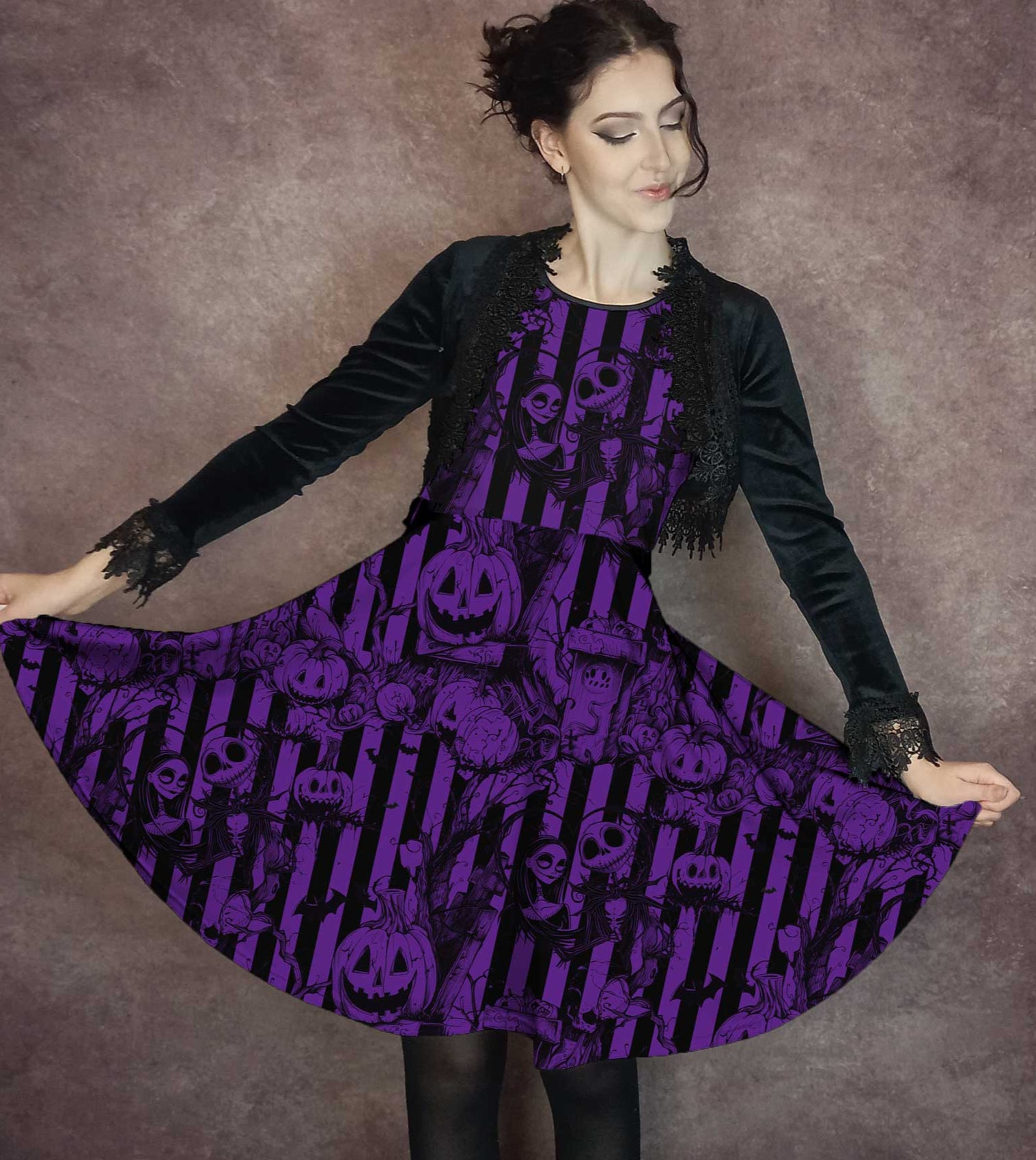 Woman wearing a purple nightmare before christmas dress against a brown background