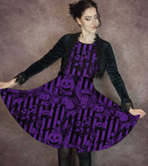 Woman wearing a purple nightmare before christmas dress against a brown background