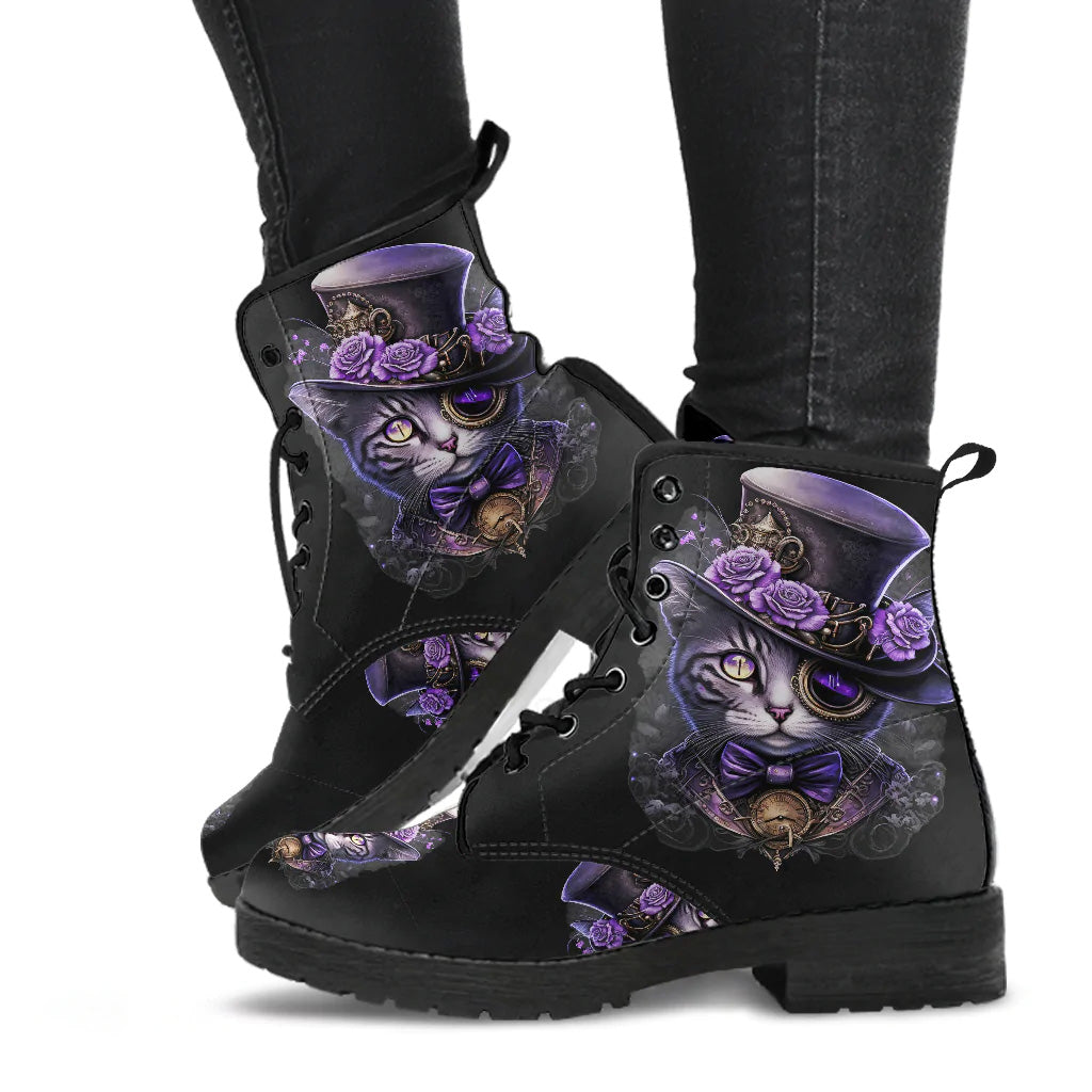 image shows a pair of black laceup combat boots with a custom print of a steampunk cat complete with top hat and goggles in purple.