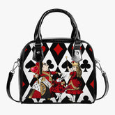 alice in wonderland queen of hearts handbag purse featuring a black, red and white playing cards background with the queen of hearts, queen alice and the white rabbit in vibrant reds and golds in the foreground. the bag has black handles and shoulder strap and is approximately 9 inches wide and 8 inches high. very bright eye catching accessory