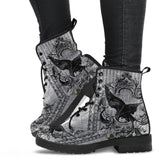 image shows black and grey custom printed lace up combat boots just above ankle length with black soles and laces. The print features swooping ravens on a vintage wallpaper style background in grey