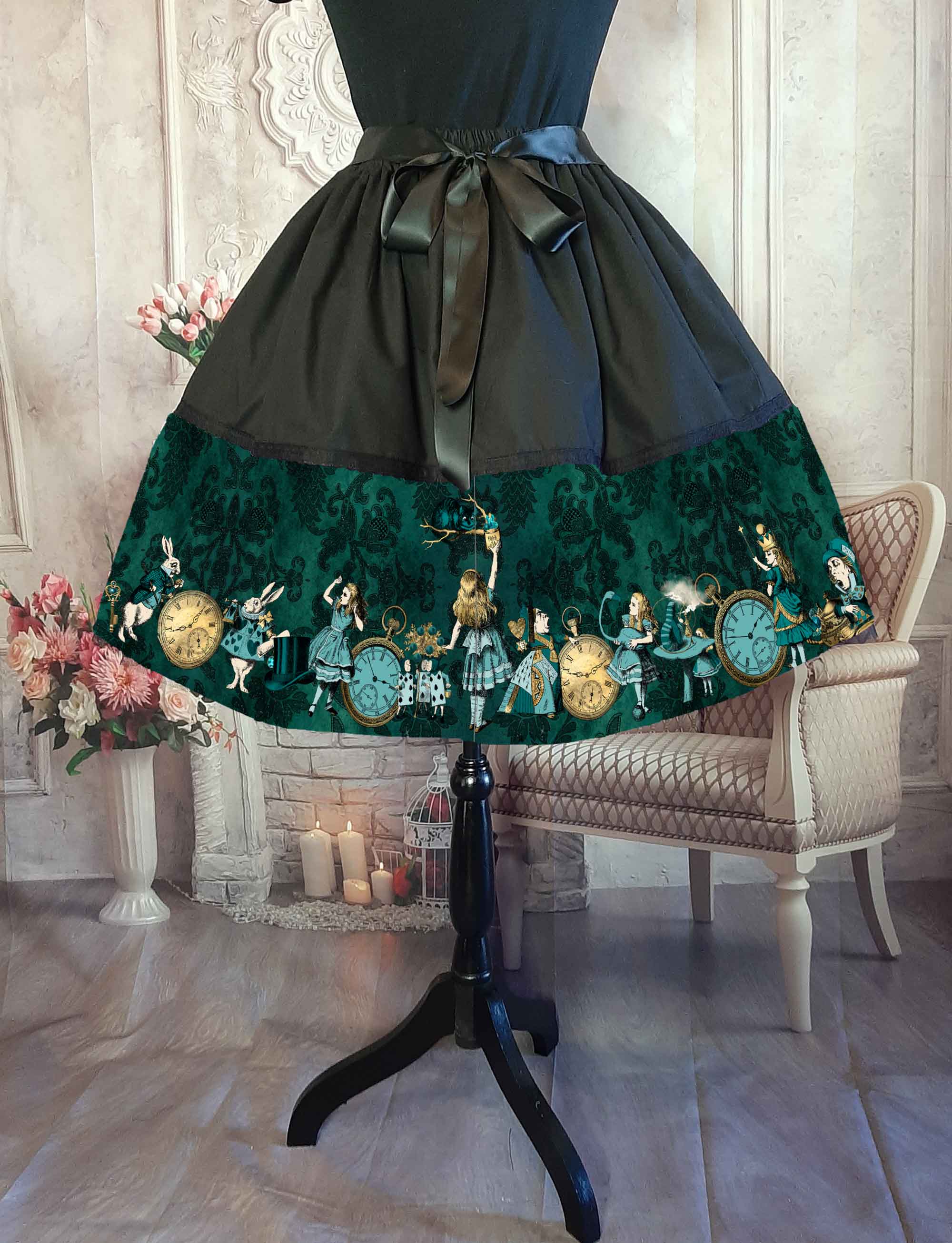 alice in wonderland full 50's style knee length skirt. Dark bottle green and black with Alice characters in green and gold. Adjustable waist up to 50 inches, suitable for plus sizes