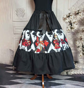 Alice in Wonderland queen of hearts tea party skirt. A mid calf length skirt in vibrant red, gold, black and white. This full skirt has an adjustable waist.