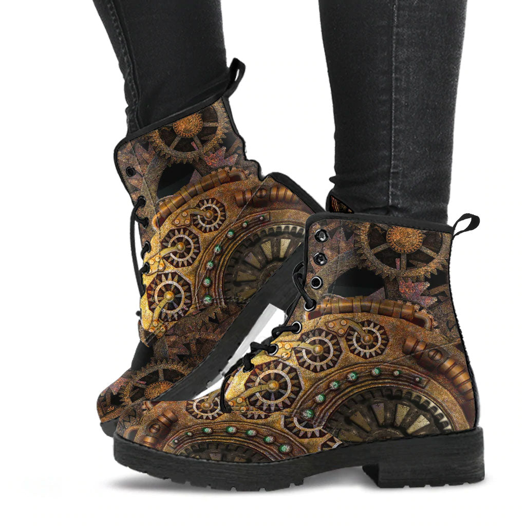 image shows steampunk lace up combat boots just above ankle length. The boots feature a steampunk clockwork gears print in browns and gold tones. The boots have black soles and black lacing.