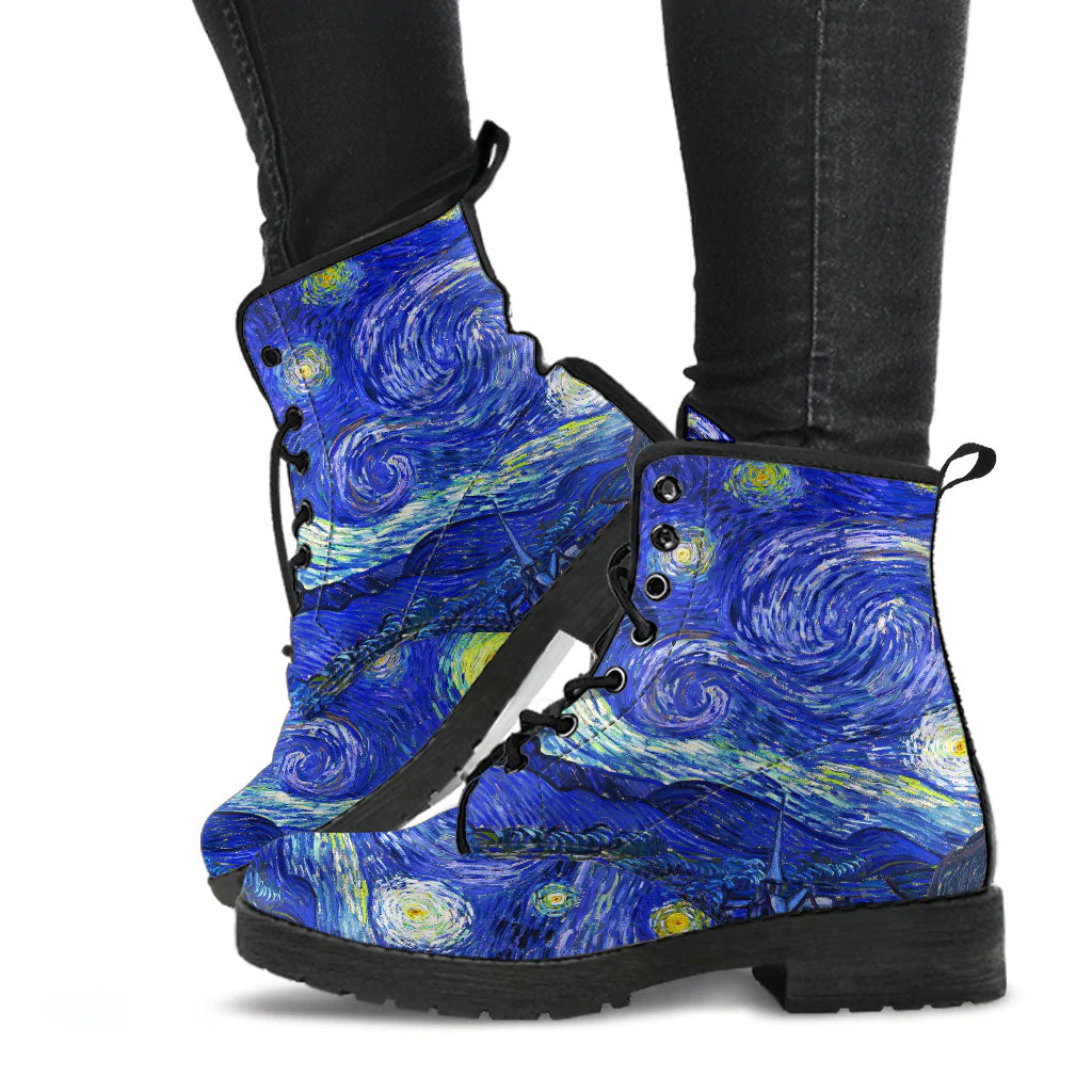 image shows vegan leather lace up combat boots custom printed with van gogh's starry night painting. The boots are just above ankle length and have black soles and black laces