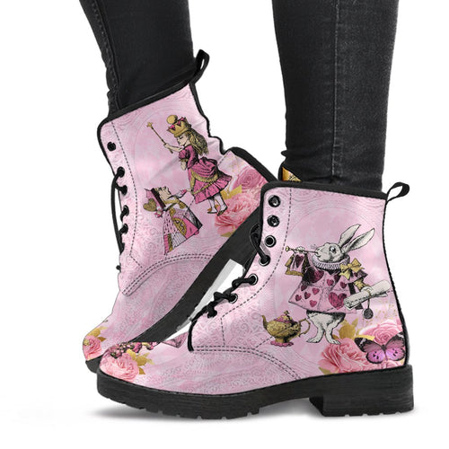 image shows a pair of pink vegan leather combat style boots. featuring a custom print of pink and gold alice in wonderland characters.  The white rabbit, queen of hearts, Queen alice are custom printed on the sides of the boots on a soft pink background.  Characters are surrounded by pink flowers and butterflies.  The boots have a black sole and laces.