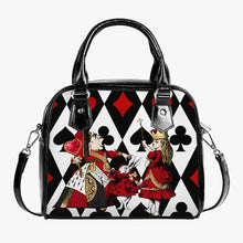 Load image into Gallery viewer, alice in wonderland queen of hearts handbag purse featuring a black, red and white playing cards background with the queen of hearts, queen alice and the white rabbit in vibrant reds and golds in the foreground.  the bag has black handles and shoulder strap and is approximately 9 inches wide and 8 inches high.   very bright eye catching accessory
