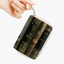 Load image into Gallery viewer, small zippered wallet featuring a print of vintage books including titles by shakespeare, jane austen and edgar allan poe.  
