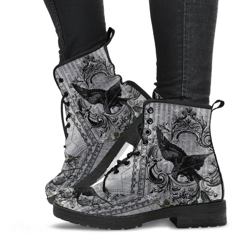 image shows black and grey custom printed lace up combat boots just above ankle length with black soles and laces.  The print features swooping ravens on a vintage wallpaper style background in grey