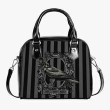 Load image into Gallery viewer, gothic handbag featuring grey and black stripes with a picture of a raven and the words nevermore underneath.  The overall look of the bag is gothic and the bag has black handles and a shoulder strap
