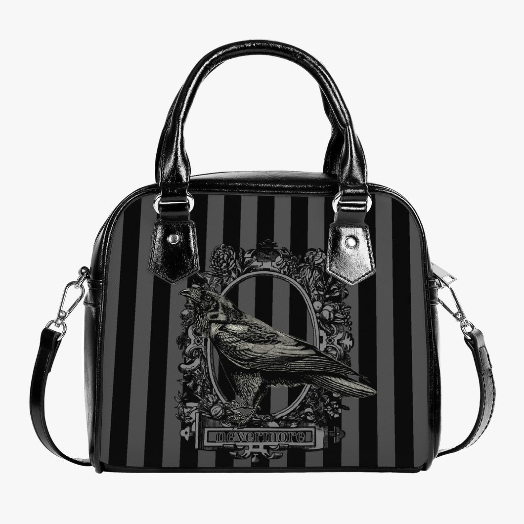 gothic handbag featuring grey and black stripes with a picture of a raven and the words nevermore underneath.  The overall look of the bag is gothic and the bag has black handles and a shoulder strap