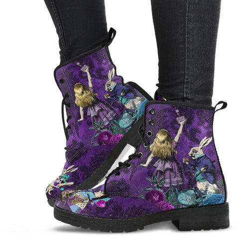 Purple vegan leather lace up combat boots in purple.  Just above ankle length boots. background is vibrant purple damask print in the foreground alice is reaching for the drink me bottle wearing a purple dress, she is looked at by the white rabbit and surround by blue and pink flowers and a green teapot