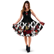 Load image into Gallery viewer, alice in wonderland queen of hearts sleeveless sundress.  A slimline bodice with a scooped neckline in black with a white rabbit in the centre of the chest, the skirt part of the dress features a vivid print of the queen of hearts, alice, the white rabbit and other characters in vivid red and gold on a black and white playing cards background

