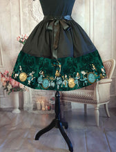 Load image into Gallery viewer, alice in wonderland full 50&#39;s style knee length skirt.  Dark bottle green and black with Alice characters in green and gold.  Adjustable waist up to 50 inches, suitable for plus sizes 

