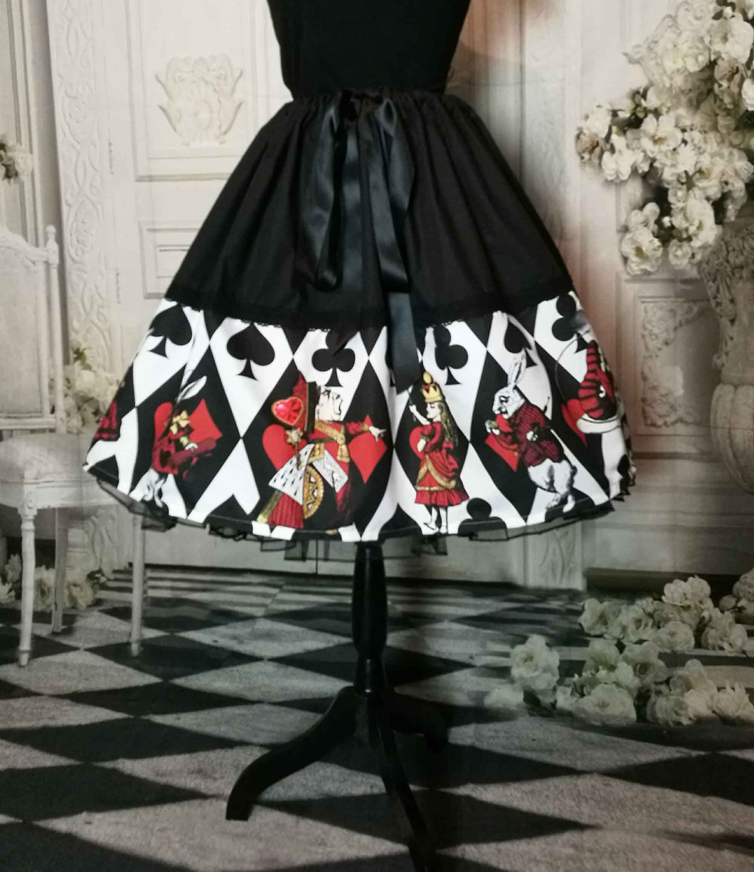 alice in wonderland full 50's style knee length skirt. Alice characters in black and white, red and gold. Adjustable waist up to 50 inches, suitable for plus sizes